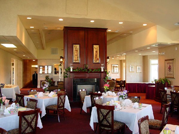 view of fireplace in the middle of dining tables