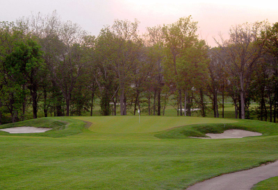 view of green flanked by bunkers on both sides